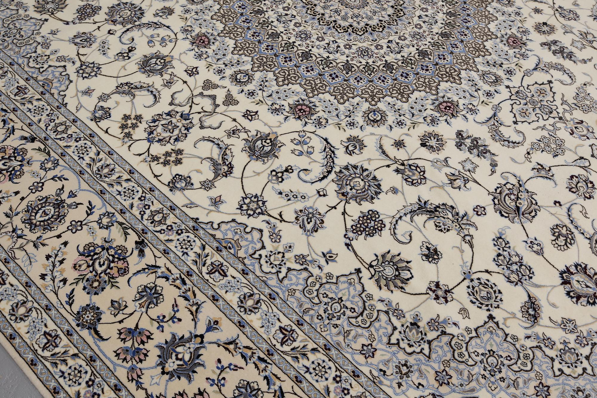 A Nain part silk carpet, 408 x 308 cm.