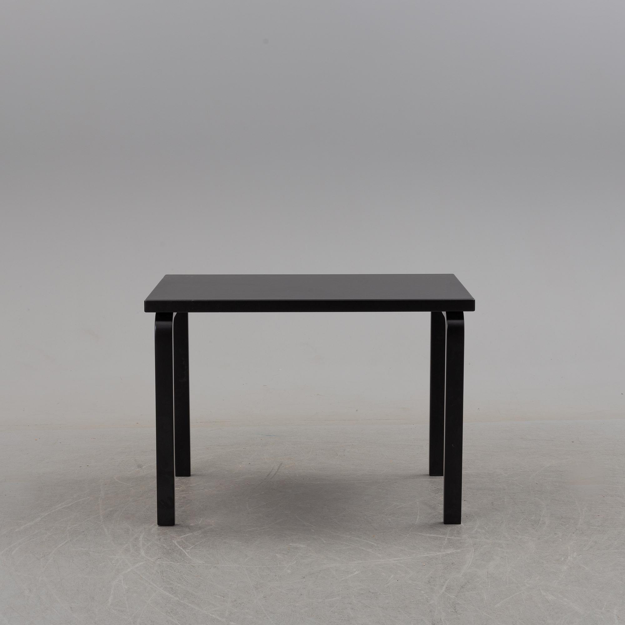 a dining table '81B' and four '69' chairs by Alvar Aalto, Artek.