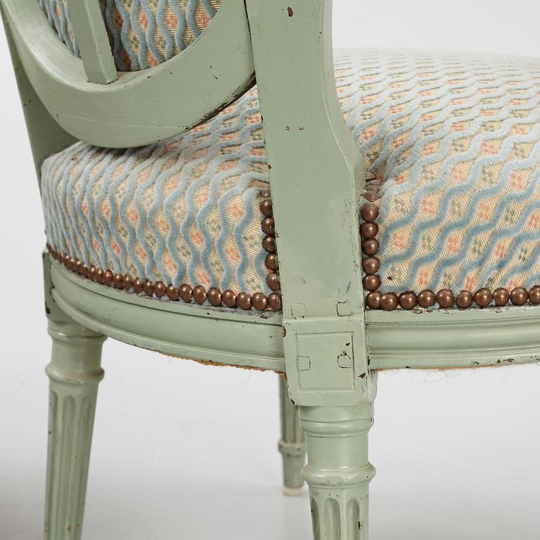 A pair of French Louis XVI open armchairs, late 18th century.