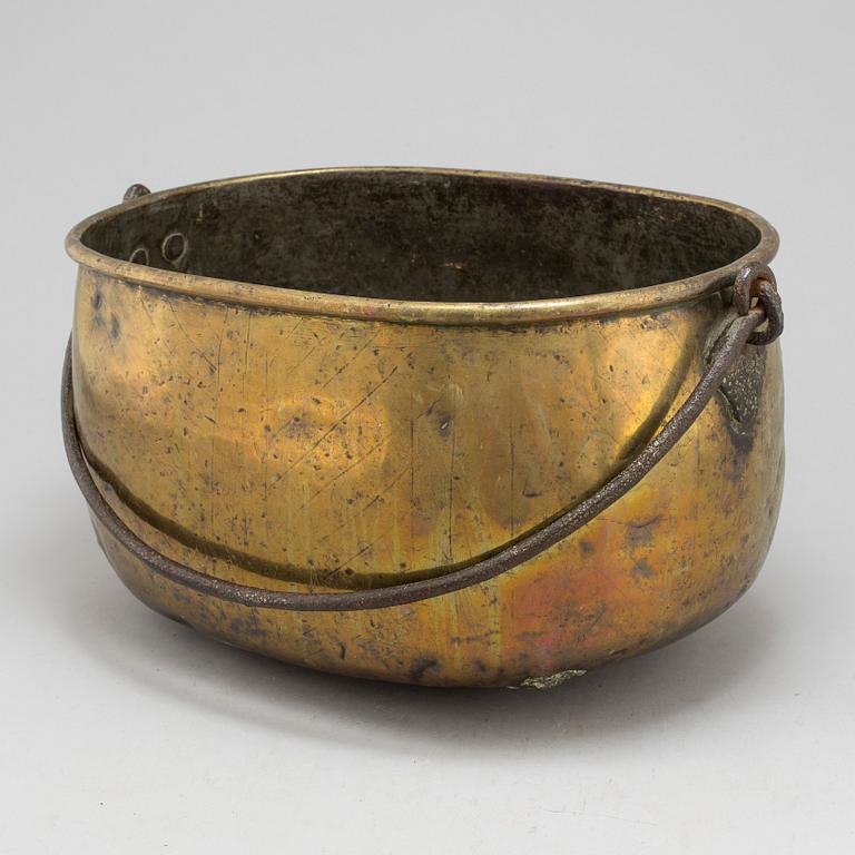 An 18th century brass cauldron.