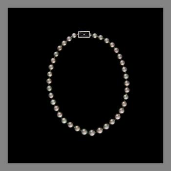 A PEARL NECKLACE, Tahiti pearls, clasp in 14K white gold with onyx and diamonds.