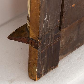 An Empire mirror, first half of the 19th century.