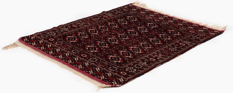 An antique Yomut rug, Western Turkmenistan, c. 119 x 104 cm.