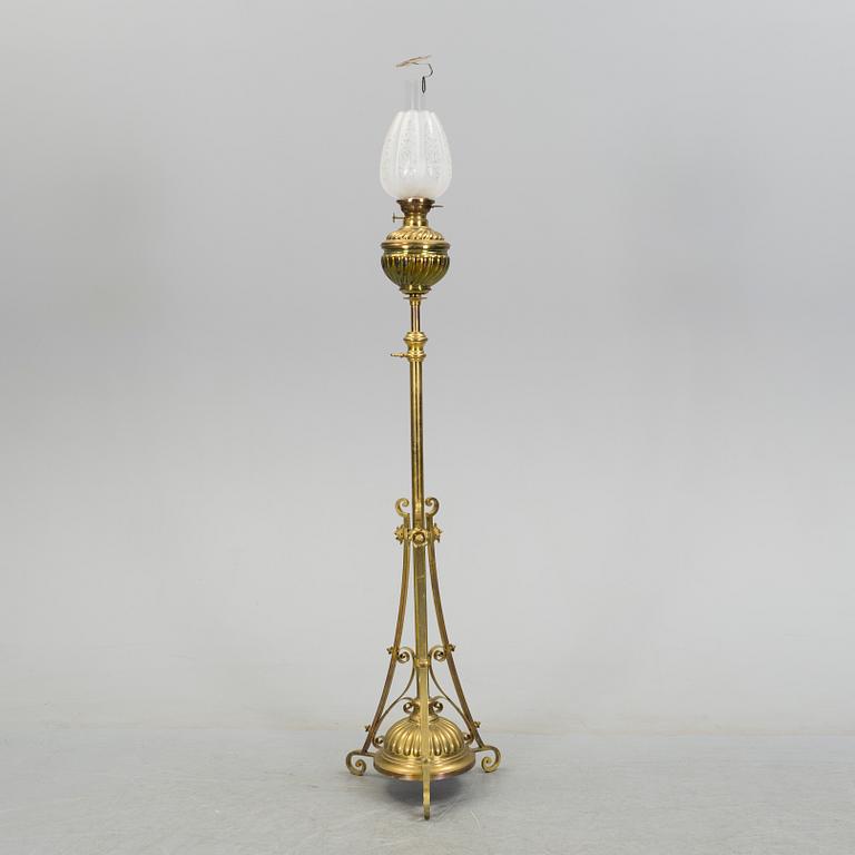 A floor brass paraffin lamp around 1900.