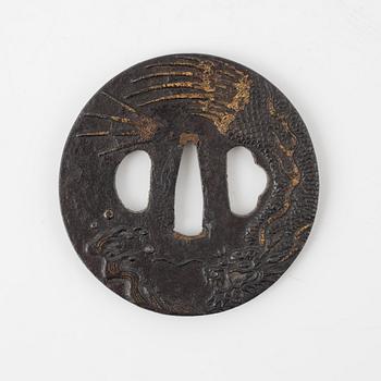 A round iron tsuba decorated with a dragon, Japan, Edo-period,