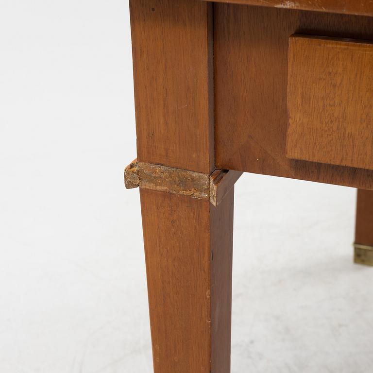 An mahogany veneered Empire style library table by Lorentz Wilhelm Lundelius Stockholm 1818-1857.