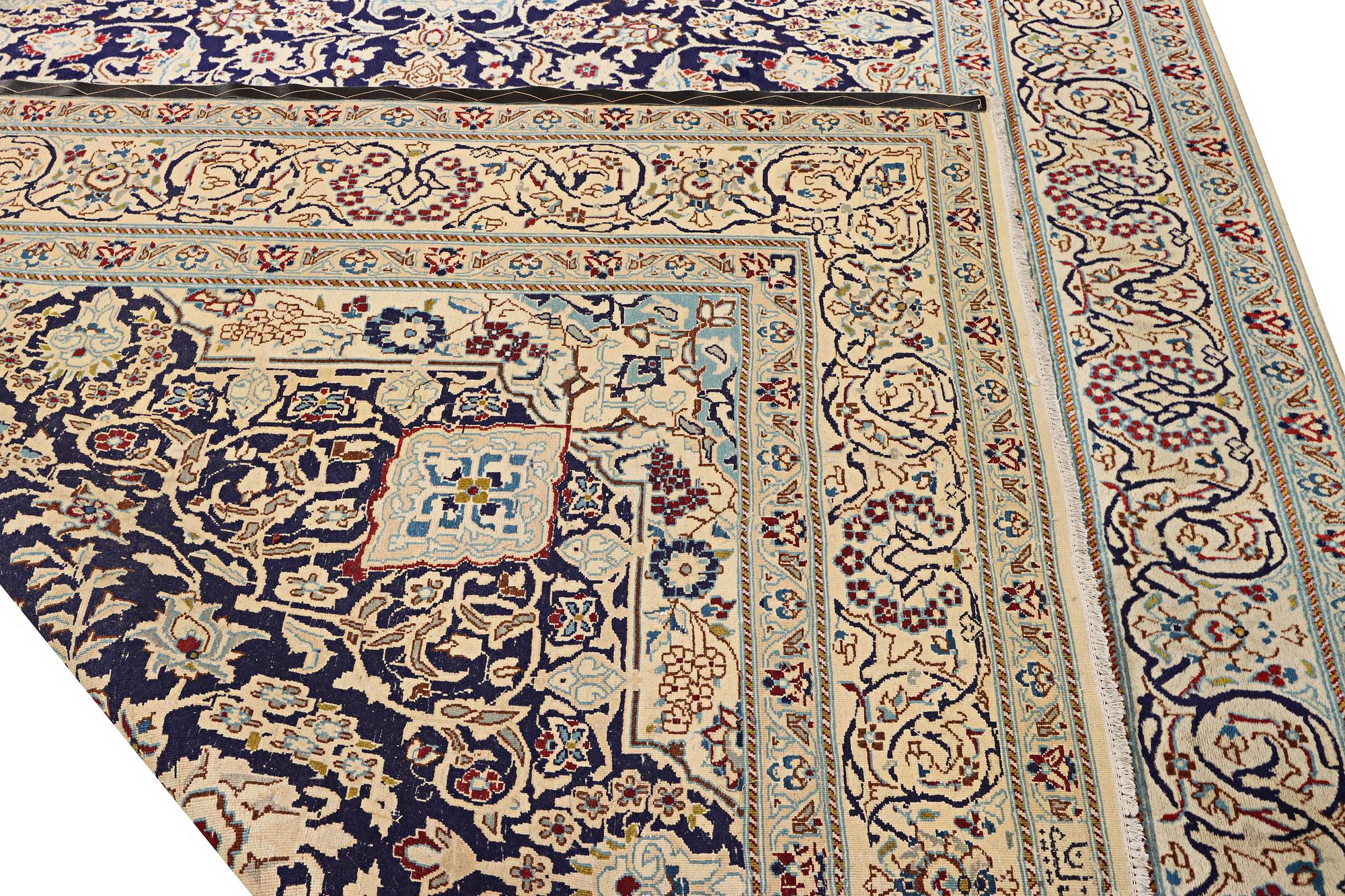 A Nain carpet, part silk, c. 338 x 244 cm.