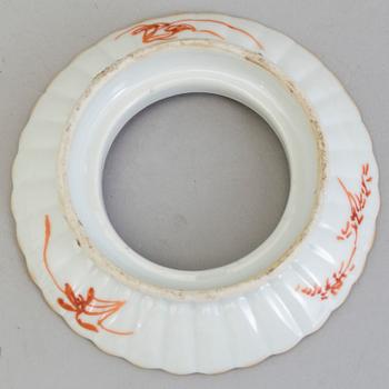 A Chinese famille rose porcelain cup with stand, Qing dynasty, Tongzhi (1862-1874), with Tongzhis mark to the base.