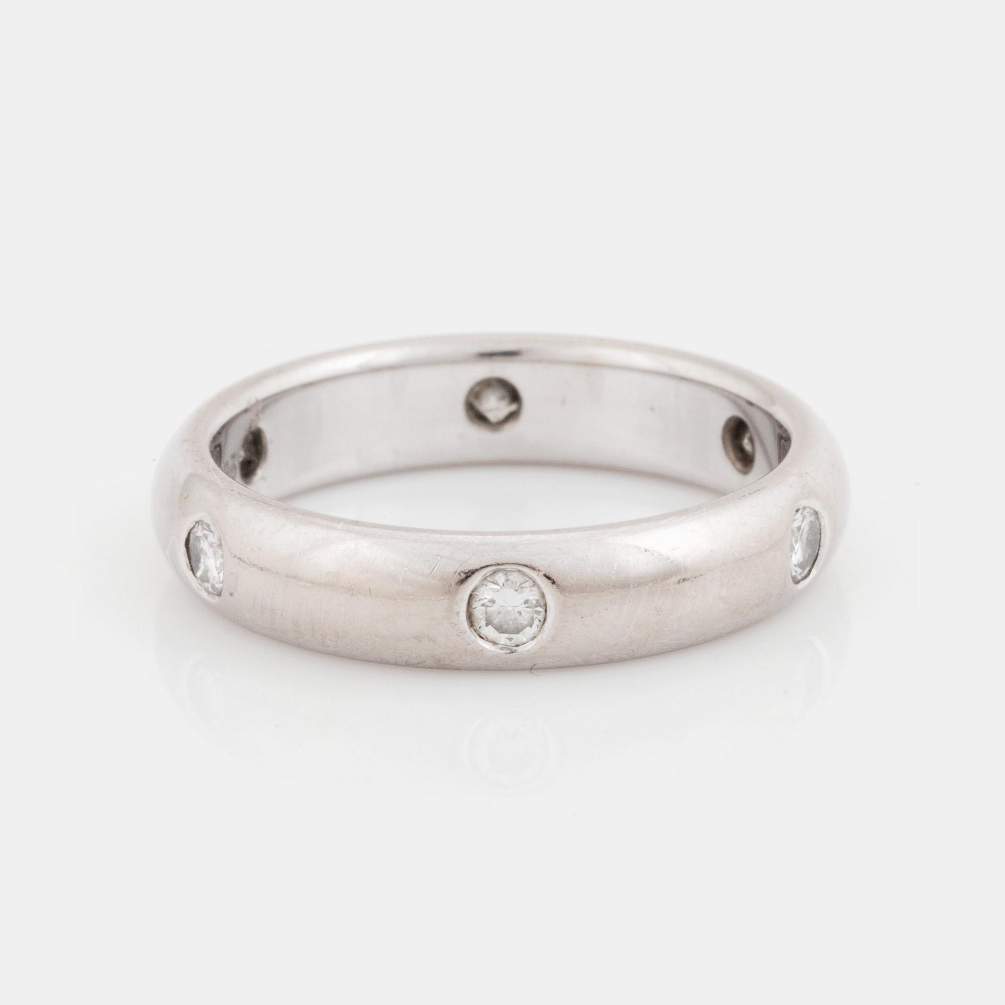 An 18K white gold Cartier ring set with round brilliant-cut diamonds.