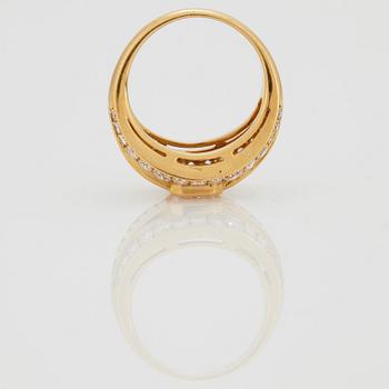 A RING set with an emerald-cut diamond.