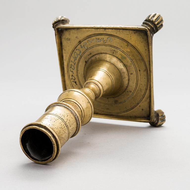 A late 17th century Spanish brass candlestick.