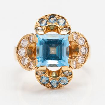 An 18K gold ring "Catherine Jagiellon" with diamonds ca 0.37 ct in total and topazes. Ofelia Jewelry, Helsinki 1998.