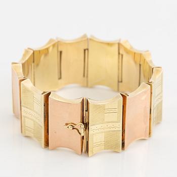 A 14K gold bracelet.
