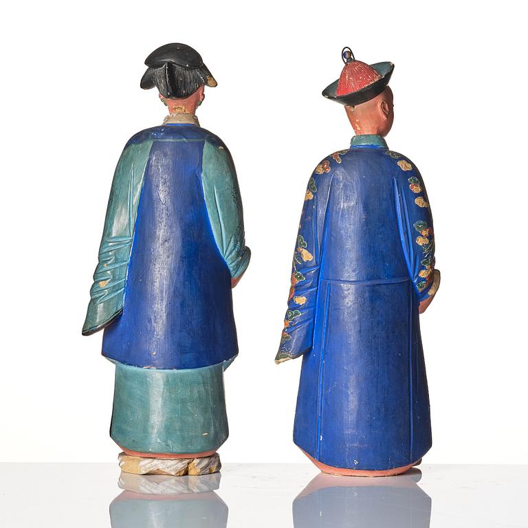 A pair of Chinese Export polychrome painted nodding head figures, Qing dynasty, early 19th Century.