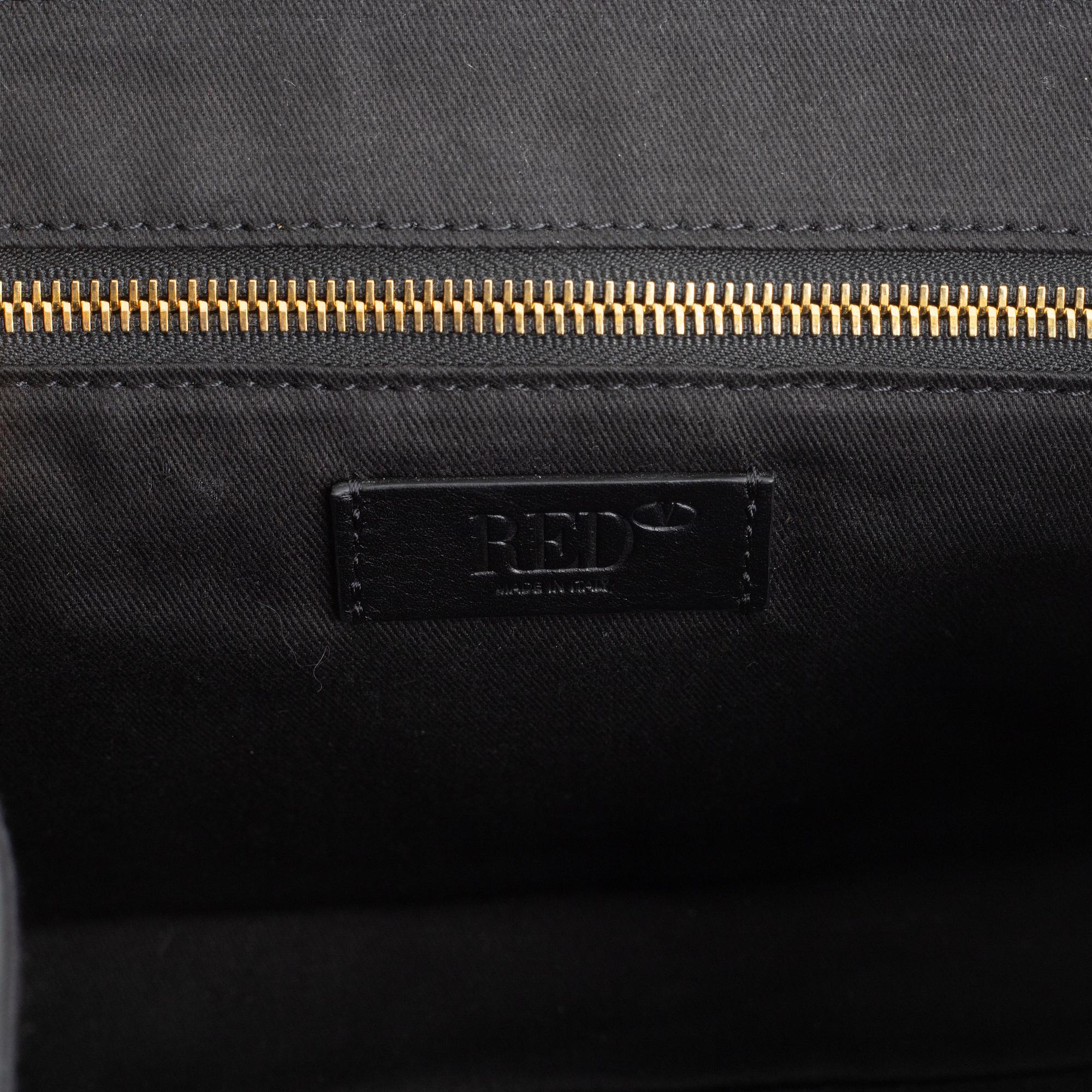 Valentino Red, A black leather snake bag.