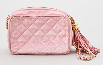 A pink silk shoulder bag by Chanel.