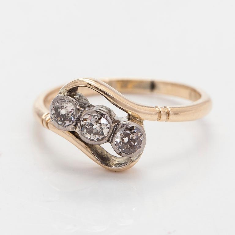 A 14K gold ring with old-cut diamonds.