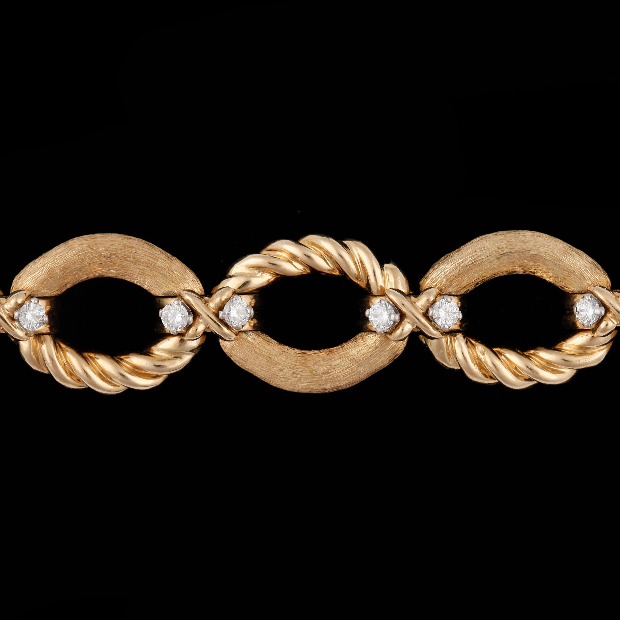 ARMBAND, Tiffany, guld med briljantslipade diamanter, tot. 1.20 ct.