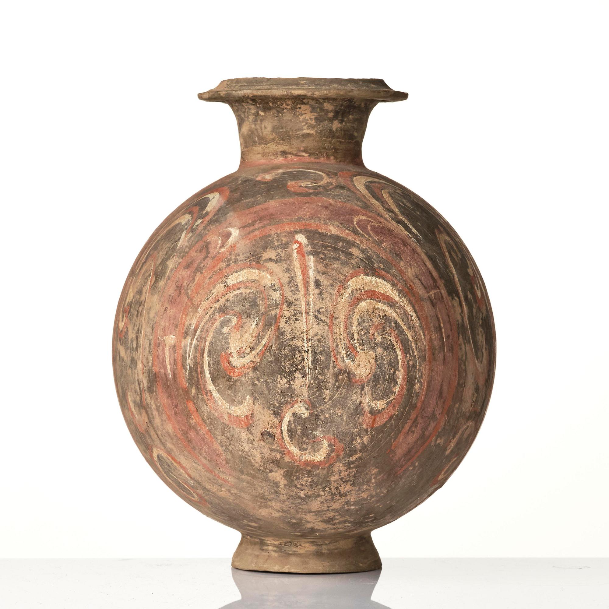 A well-painted dark grey pottery cocoon jar, 
Han dynasty (206 BC-AD 220).