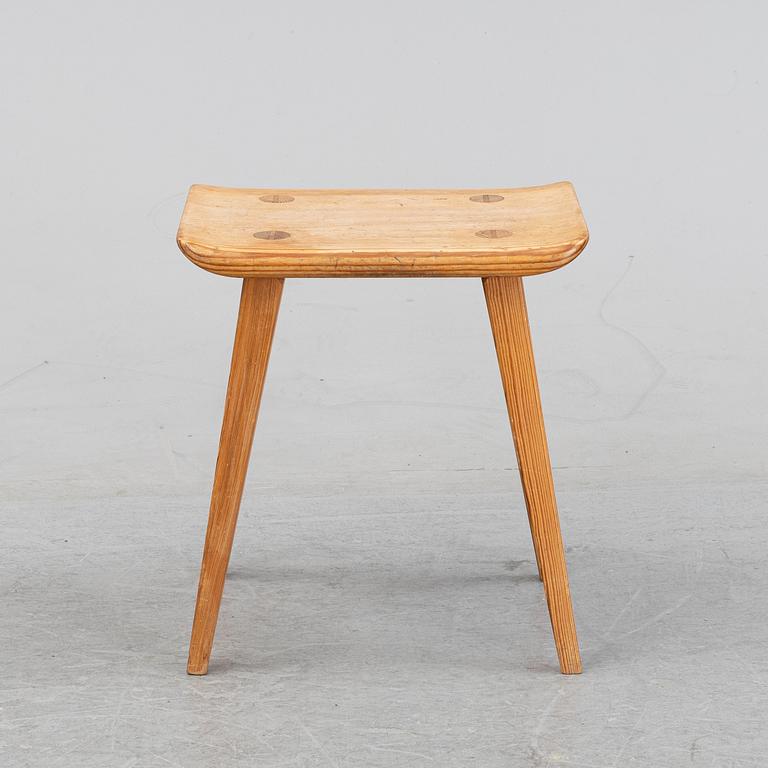 A pine stool by Carl Malmsten for Karl Andersson.