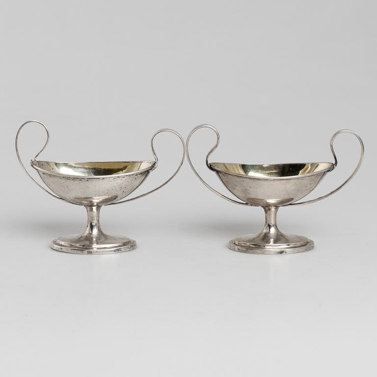 A pair of firt half of the 19th century parcel-gilt silver salt-cellars by an uknown master, one marked HB.