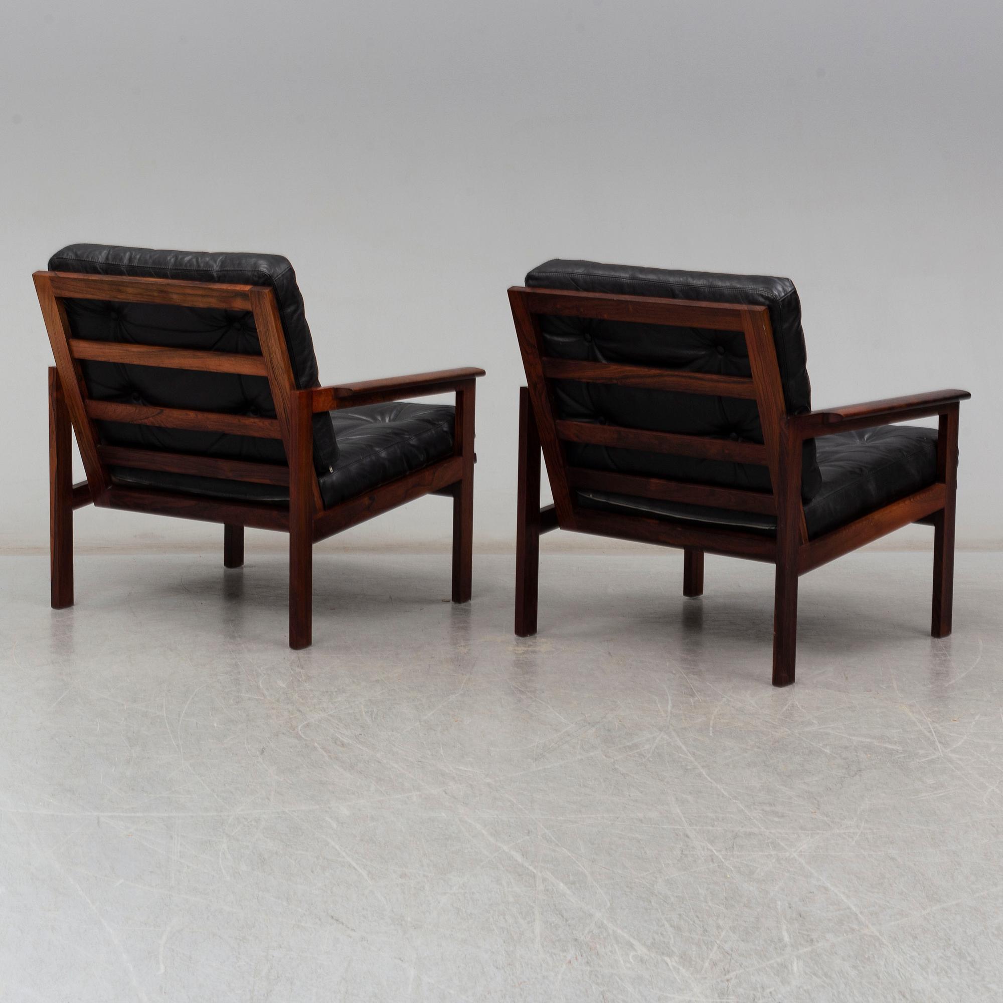 A pair of 'Capella' rosewood easy chairs by Illum Wikkelsø.