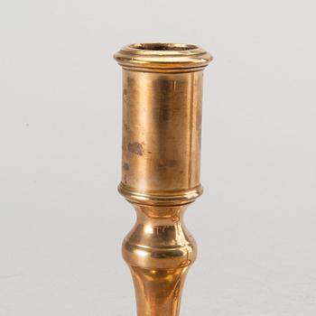 A pair of Swedish brass 18th century candlesticks.