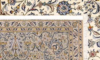 A Keshan carpet, signed, approx. 390 x 282 cm.