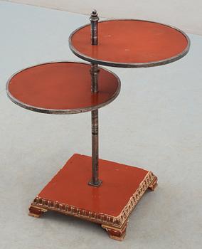 An Axel-Einar Hjorth red lacquer table 'Åbo' on a silver plated brass leg, Nordiska Kompaniet (NK) 1929-30.