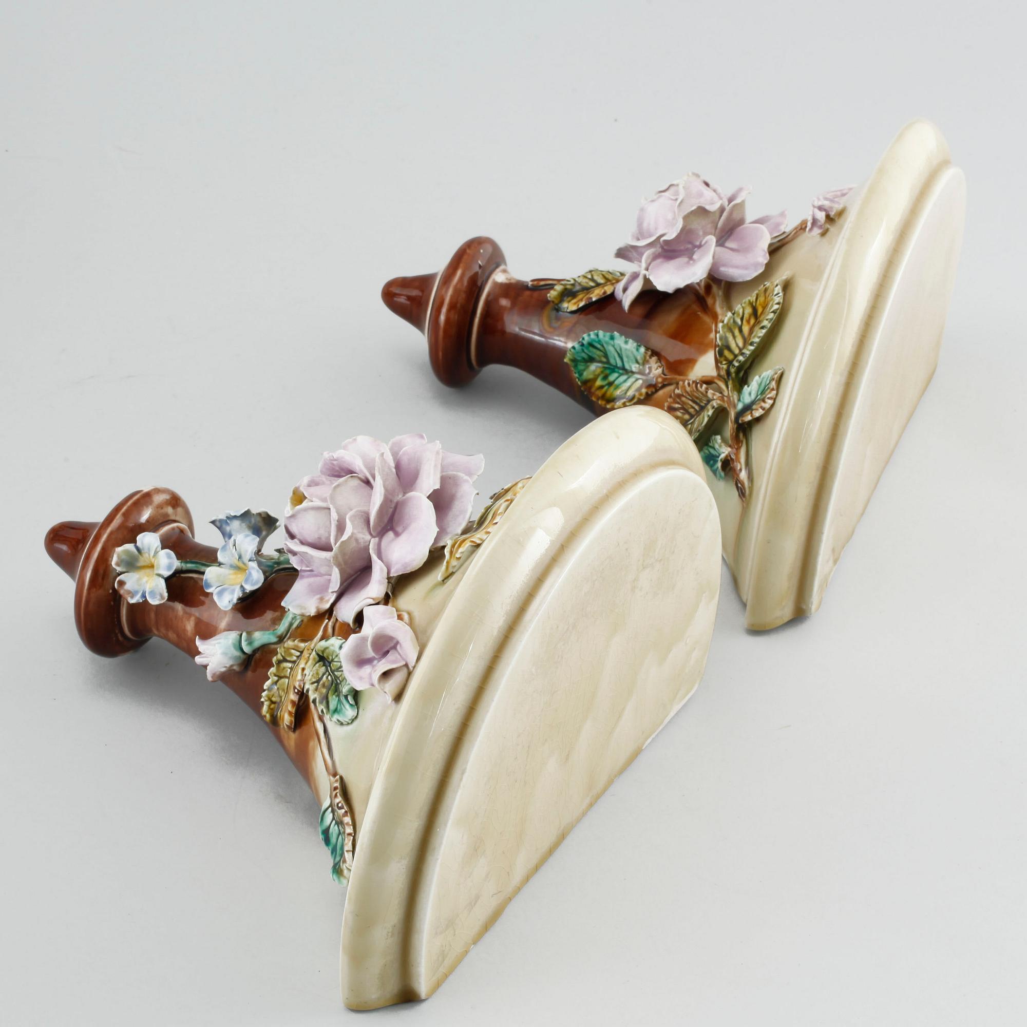 A pair of consoles, a pot and a jardinière in majolica, made by Gustavsberg and Rörstrand around year 1900.