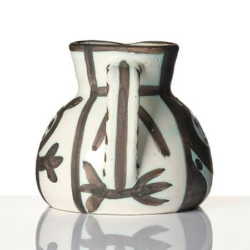 Pablo Picasso, a "Pichet petites têtes" (A.R. 222) faience pitcher, Madoura, Vallauris, France, post 1953.
