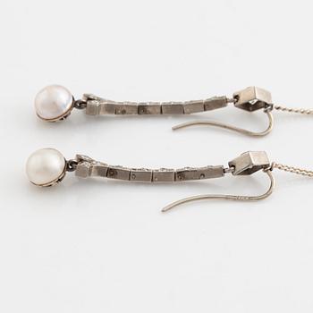 A pair of 18K gold and cultured halfpearl and diamond earrings.