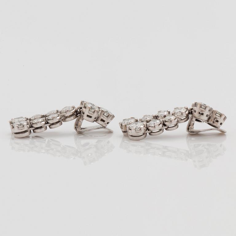 A pair of brilliant cut diamond earrings. Total carat weight circa 7.35 cts.