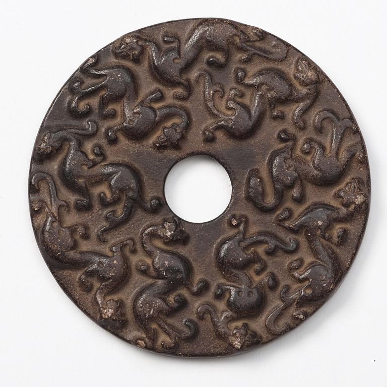 A group of three archaistic Chinese stone bi discs and two pendants.