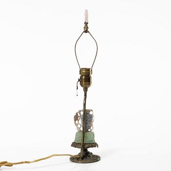 A Chinese table lamp with a carved stone vase with cover, 20th century.