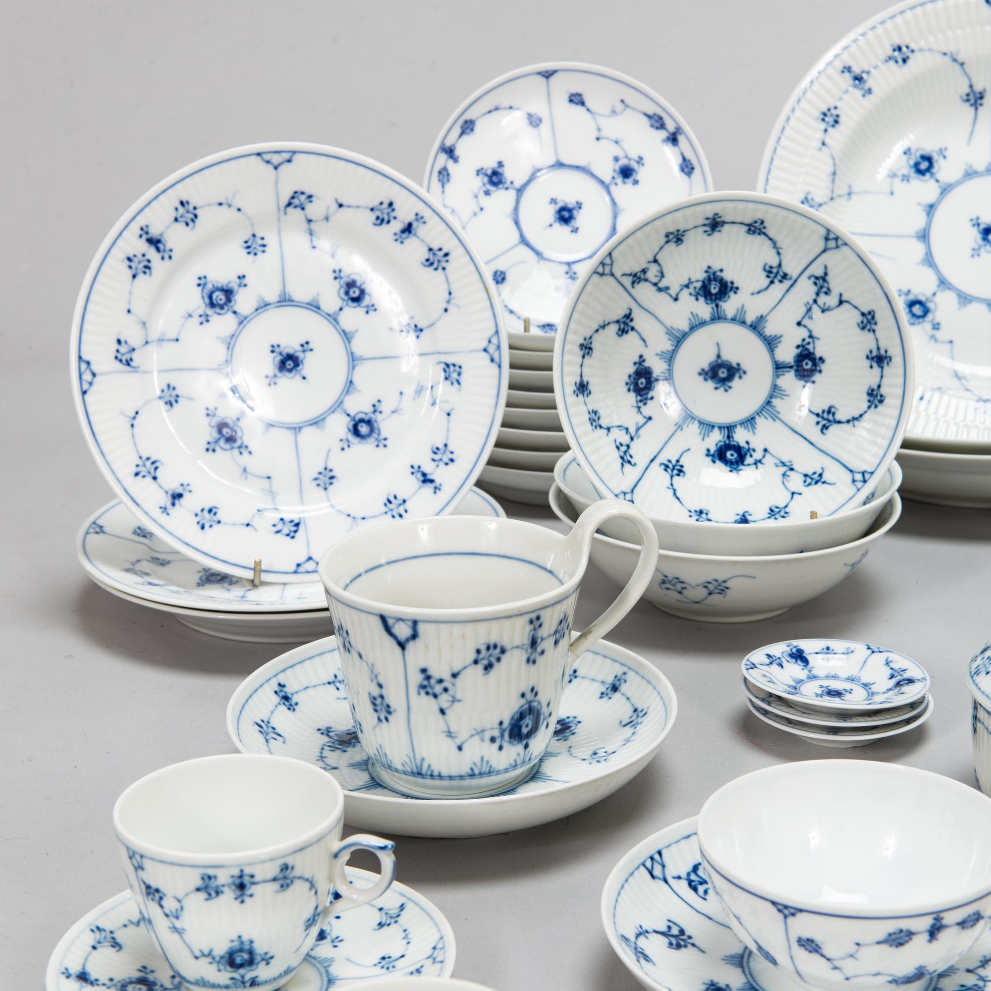 A 73-piece 'Blue Fluted Plain' porcelain tableware set, Copenhagen, Denmark, mostly 1940s-60s.