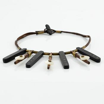 Vivianna Torun Bülow-Hübe, a necklace, wood, leather, mother-of-pearl and brass, most likely 1950's.