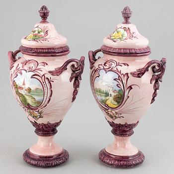 A pair of earthenware vases with covers, early 20th century.