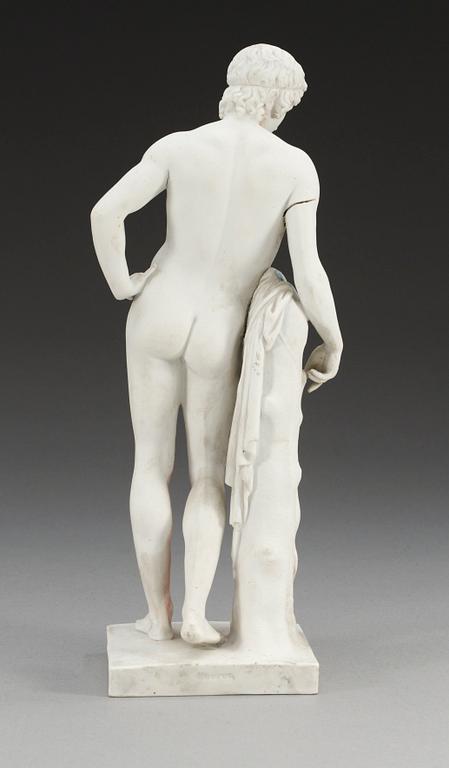 A Royal Copenhagen bisquit figure of a young man, 19th Century.