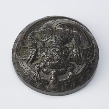 A bronze dragon a and bird weight, Warring states (475–221 BC).