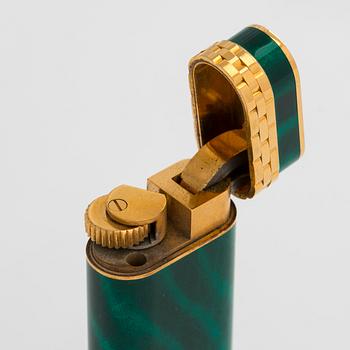 Cartier, A gilded and laquered metal lighter. Marked Cartier, Paris, 6846 X, Swiss made.