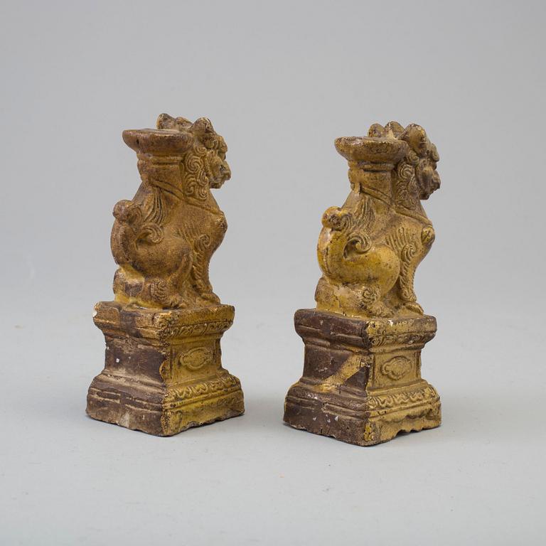 A pair of yellow glazed chinese joss sticks holders, 17th Century.