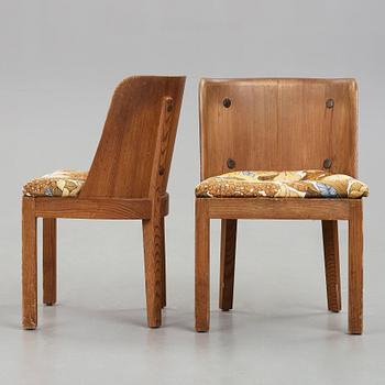 Axel Einar Hjorth, a pair of "Lovö" stained pine armchairs, Nordiska Kompaniet, Sweden 1930's.