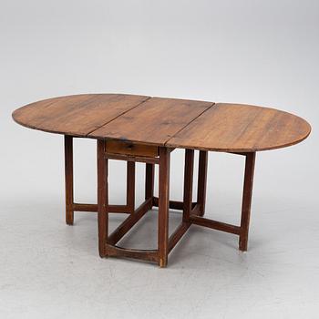 A pine gate-leg table, 19th Century.