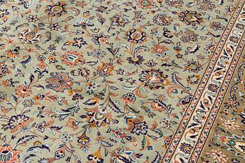 A semi-antique Kashan carpet, signed, circa 404 x 302 cm.