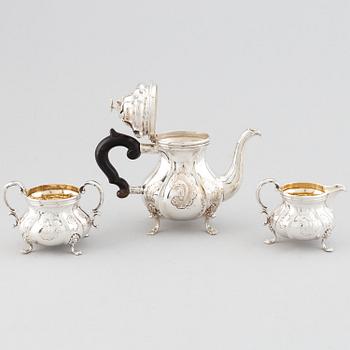 An early 20th century Rococo-style parcel gilt and silver three part coffee service.