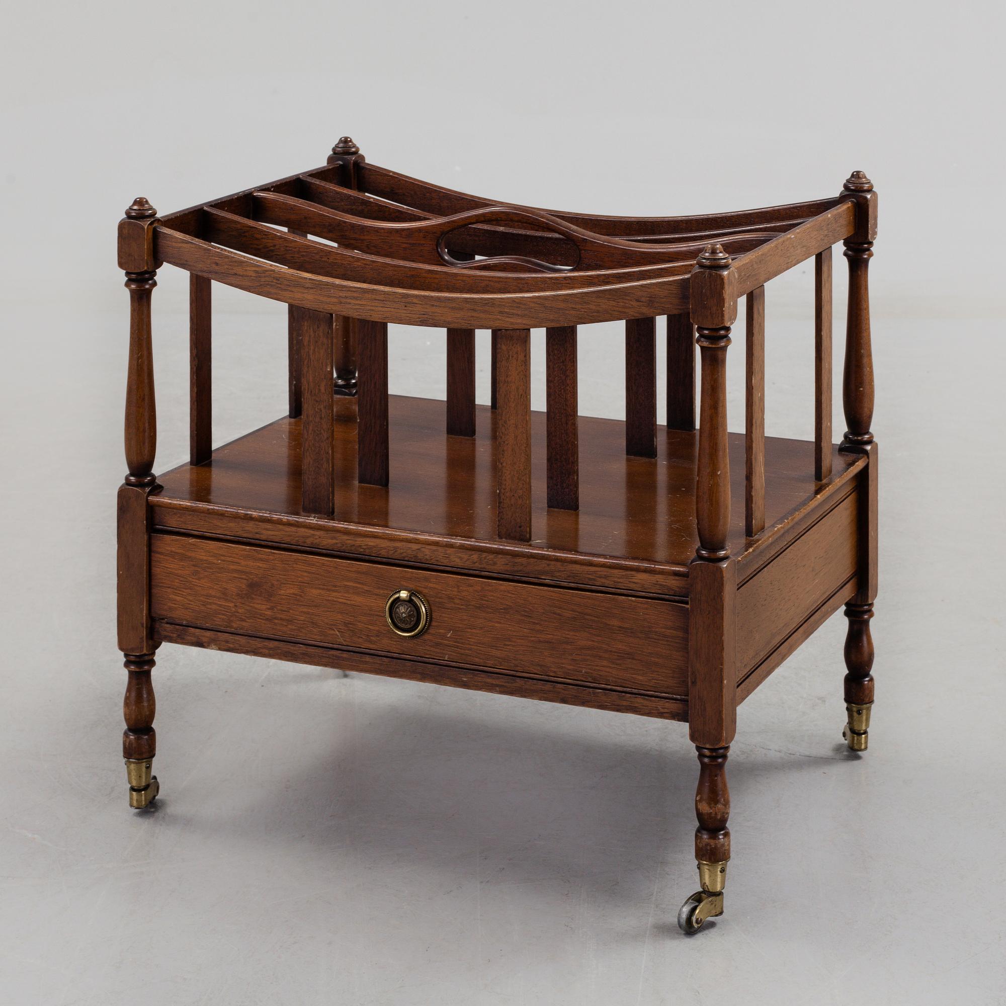 A mahogny newspaper stand (so called Canterbury), England, late 20th century.