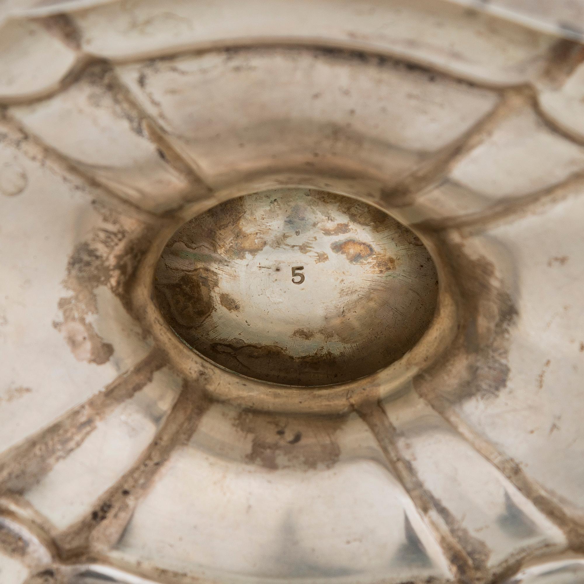 A five-piece sterling silver coffee and tea service, and 12 spoons, USA, first quarter of the 20th century.