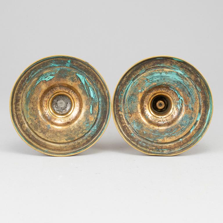 A pair of late 18th century bronze candlesticks.