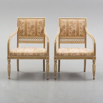 A pair of first half of the 19th century Empire arm chairs.